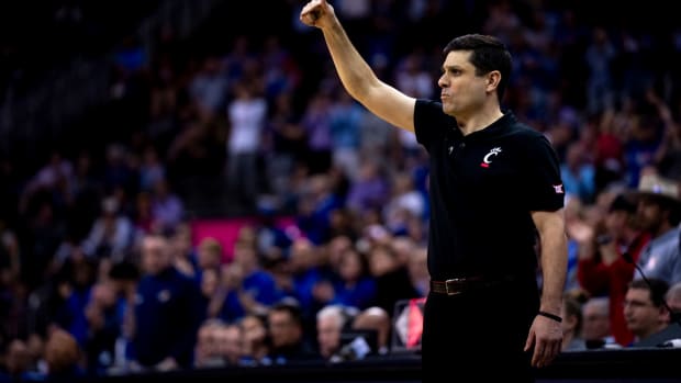 Cincinnati Bearcats head coach Wes Miller looks on in the second half of the Big 12 Conference tournament game between Cincinnati Bearcats and Kansas Jayhawks at T-Mobile Center in Kansas City, Mo., on Wednesday, March 13, 2024.
